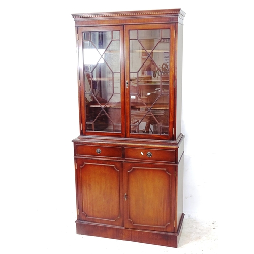 2287 - A reproduction mahogany 2-section library bookcase, W93cm, H192cm, D40cm