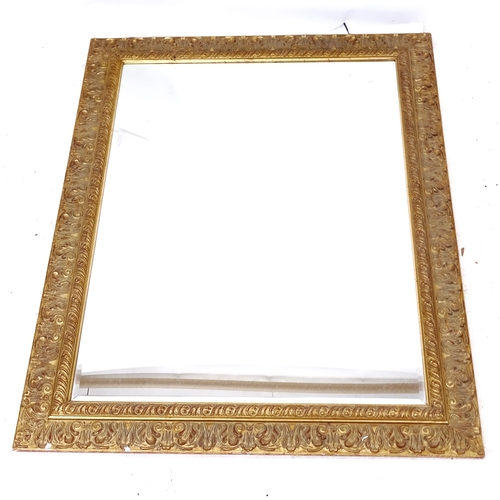 2293 - A modern carved composite-framed bevel-edge wall mirror, 106cm x 145cm