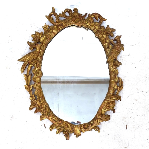 2325 - A modern giltwood oval wall mirror, W74cm, H94cm