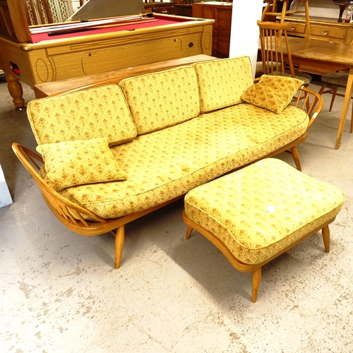 2674 - A mid-century Ercol elm and beech day bed/settee, L200cm, together with a matching footstool