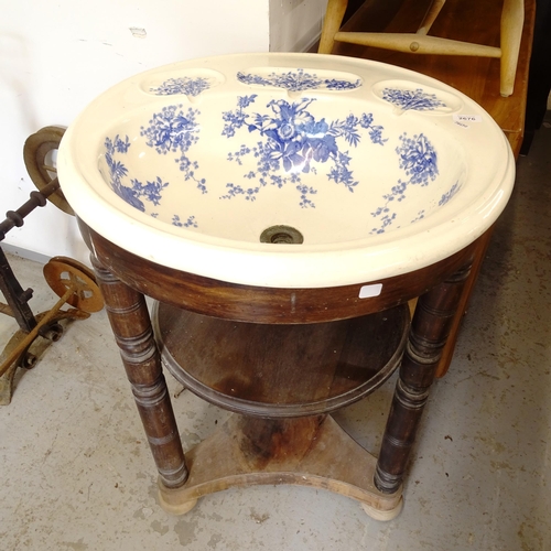 2676 - A 19th century mahogany wash stand, with a white and blue transfer printed fitted wash bowl