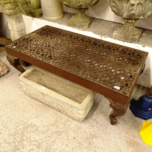 2685 - A rectangular cast-iron low table, with a pierced panel top on embossed cabriole legs, L122cm, H45cm... 