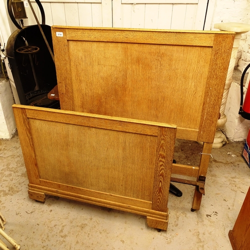 2734 - An Art Deco limed oak single bed head and foot board (no rails)