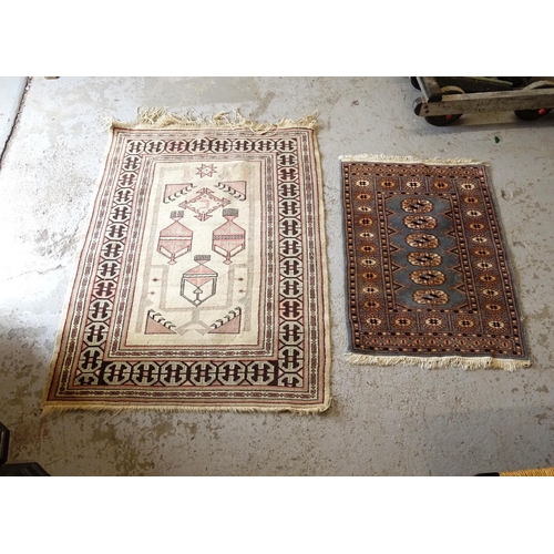 2746 - A cream ground Afghan rug, 130cm x 95cm, and a Pakistani blue ground Mari rug, 91cm x 63cm (2)