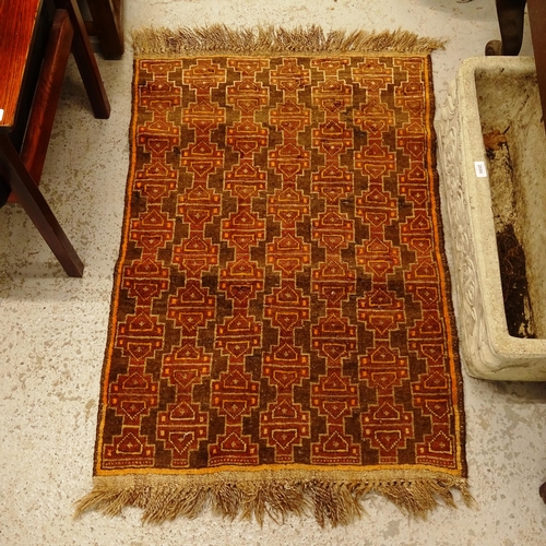 2747 - A brown ground Afghan rug with symmetrical pattern, 110cm x 76cm