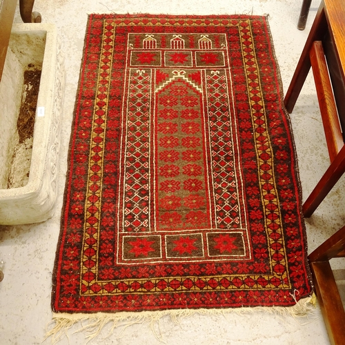 2749 - A red ground Afghan prayer rug, 134cm x 86cm