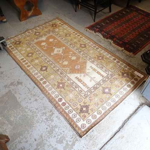 2753 - A cream ground Turkish wool rug, 196cm x 115cm