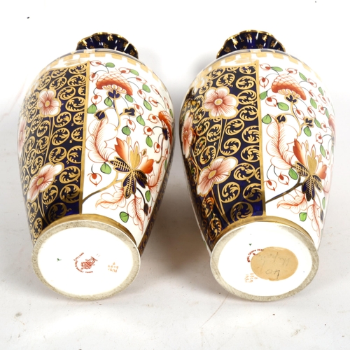 810 - A pair or Royal Crown Derby Imari style vases, with painted and gilded decoration, height 23cm