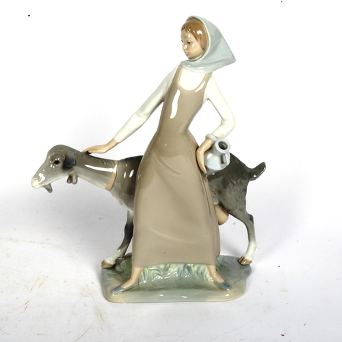 812 - A Lladro porcelain figural group, girl with goat, height 28cm