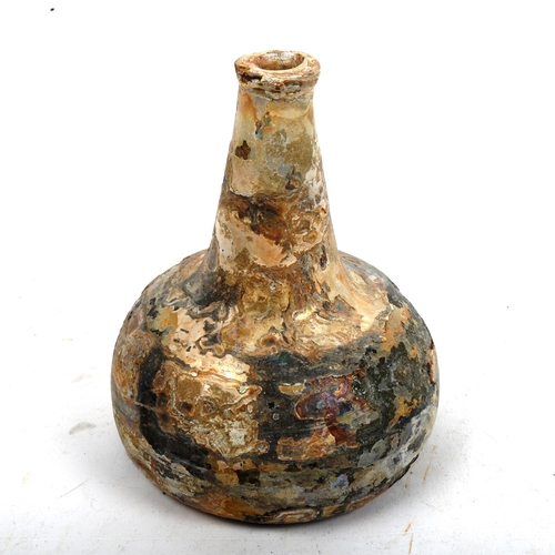 844 - An Antique green glass shipwreck onion bottle, height 17cm