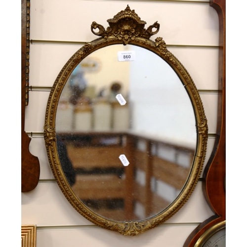 860 - A small gilt-framed oval wall mirror, height 50cm