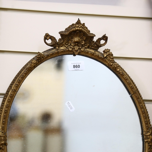 860 - A small gilt-framed oval wall mirror, height 50cm