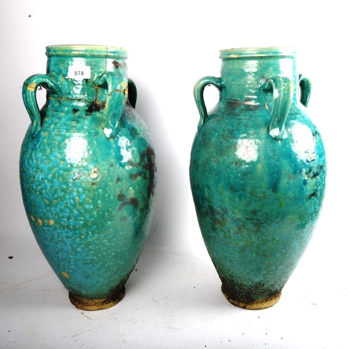 878 - A large pair of Hamadan turquoise glaze pottery oil jars, height 54cm (1 A/F)