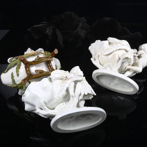 881 - A pair of white glaze porcelain cherub table centre bowls, and another similar leaf bowl (3)