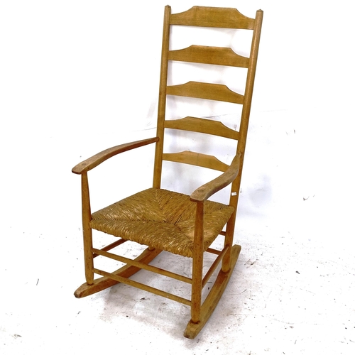 2139 - An Arts and Crafts Cotswold School rocking chair, by Neville Neal, maker's stamp to inside rear leg