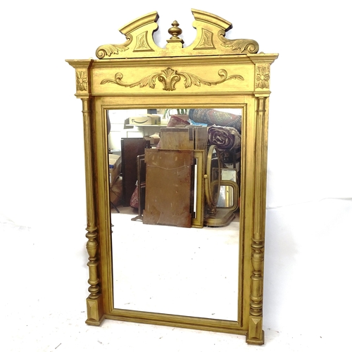 2151 - A giltwood pier glass mirror, with shaped pediment, applied acanthus leaf decoration and fluted colu... 