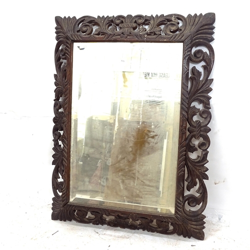 2153 - A French carved oak-framed wall mirror, W84cm, H113cm