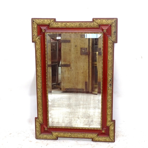 2157 - An Antique stained wood and gilt-gesso framed wall mirror of shaped form, 54cm x 81cm