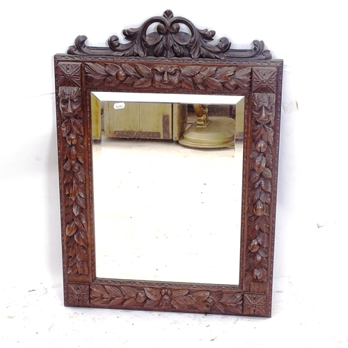 2163 - An Antique oak-framed bevel-edge wall mirror, with applied carved lion mask decoration, W56cm, H80cm