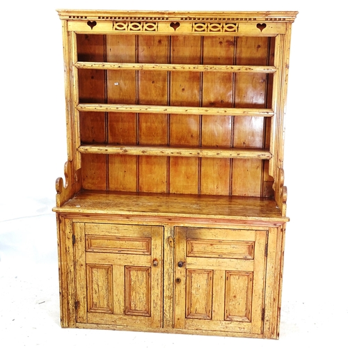 2165 - An Antique pine Irish dresser, with open plate rack, and panelled cupboard under, W141cm, H200cm, D5... 