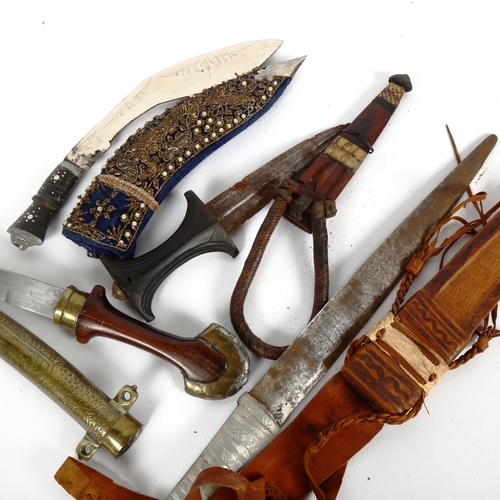 86 - Various Middle Eastern daggers, including kukri (4)