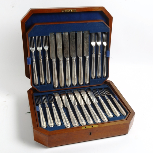 1006 - A canteen of silver plated dinner knives and forks for 18 people, with bead edge handles and engrave... 