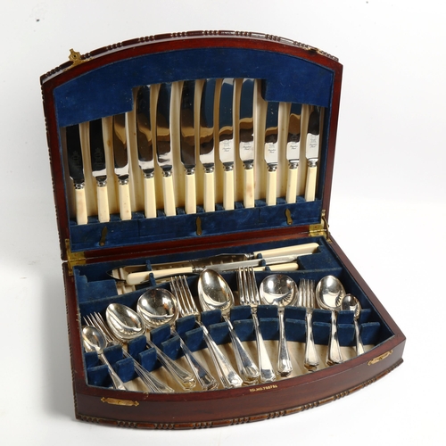 1008 - INSIGNIA PLATE - a canteen of cutlery for 6 people, including carving set, in fitted mahogany case