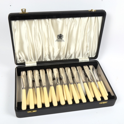 1013 - ELKINGTON & COMPANY LTD - a canteen of silver plated fish cutlery for 12 people, with ivorine handle... 