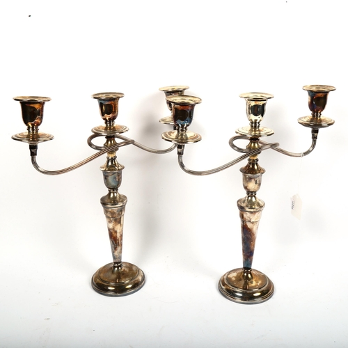 1019 - A pair of silver plated 2-branch table candelabras