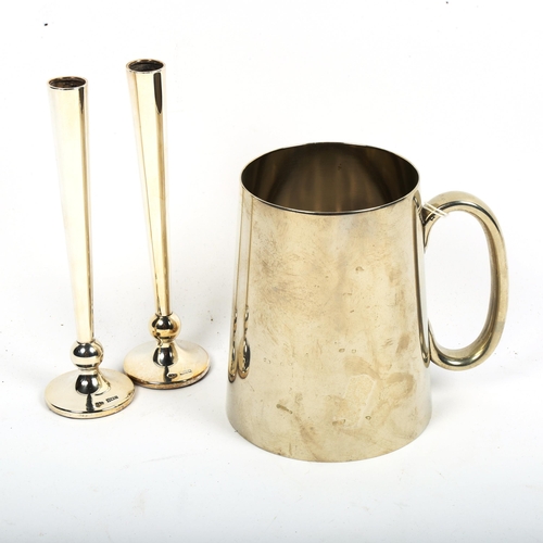 1020 - A pair of small silver bud vases, and a silver plated tankard with glass bottom