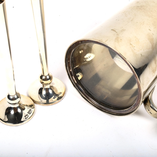 1020 - A pair of small silver bud vases, and a silver plated tankard with glass bottom