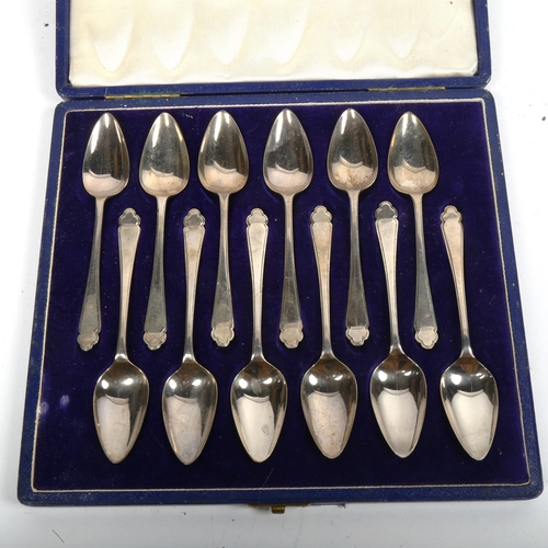 1034 - A set of 12 silver grapefruit spoons, maker's marks HH, hallmarks Sheffield 1949, length 13cm, cased