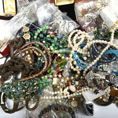 1038 - A large quantity of mixed costume jewellery, brooches, bead necklaces, filigree brooches, wristwatch... 