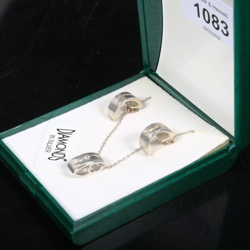 1083 - A silver and diamond set pendant necklace and pair of matching earrings