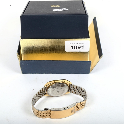 1091 - A gent's gold plated Seiko quartz digital wristwatch, boxed