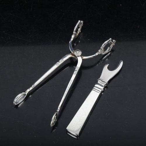 1098 - GEORG JENSEN - a silver bottle opener (boxed), and COHR - a pair of stylised silver tongs