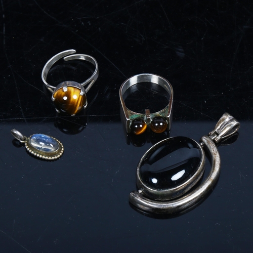 1113 - A Finnish silver tigers eye ring, a drop pendant etc