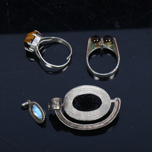 1113 - A Finnish silver tigers eye ring, a drop pendant etc