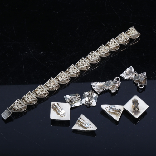 1114 - A Continental silver filigree panel bracelet, and 4 pairs of silver earrings