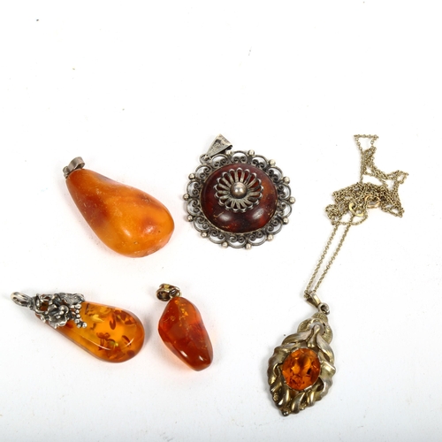 1119 - 5 various amber citrine and silver-mounted pendants