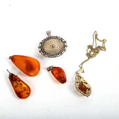 1119 - 5 various amber citrine and silver-mounted pendants