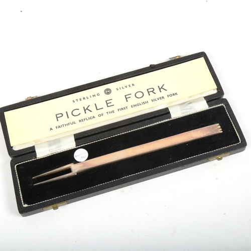 1122 - ELIZABETH II - a sterling silver pickle fork, in original box, Sheffield 1960