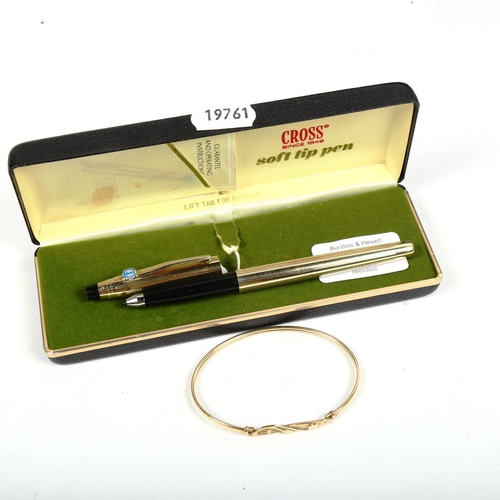 1123 - A 9ct gold bangle, 3.9g, and a 10ct gold plated soft tip pen by Cross, boxed (2)