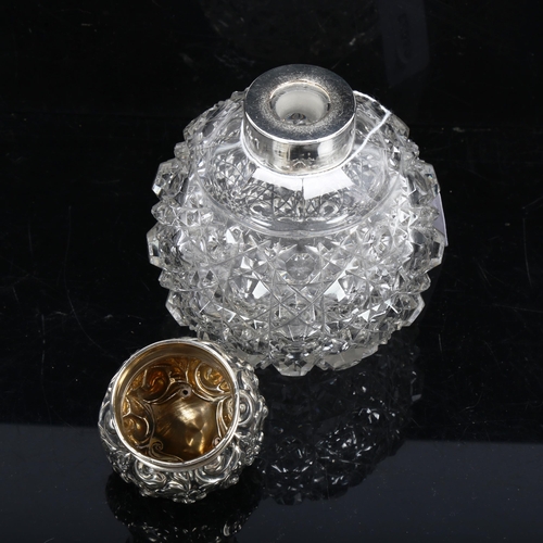 1150 - A cut-glass and silver-mounted scent bottle