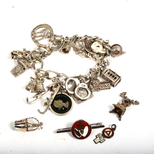 1163 - A silver charm bracelet, a silver enamel bar brooch etc