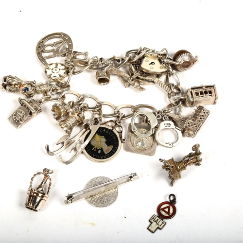 1163 - A silver charm bracelet, a silver enamel bar brooch etc