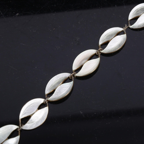 1169 - A Danish sterling silver-gilt and white enamel panel bracelet, length 19cm (1 link missing)