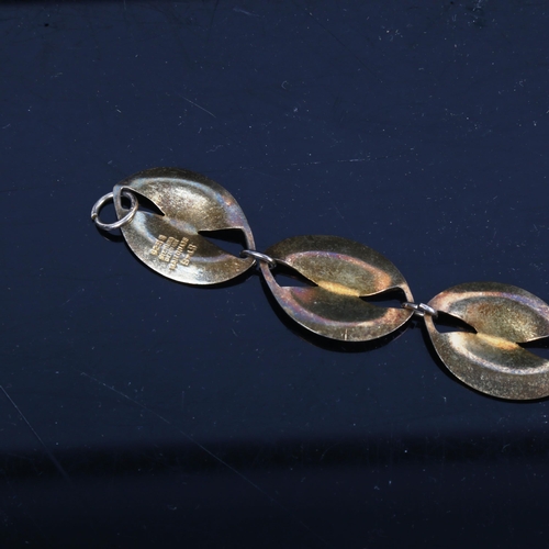 1169 - A Danish sterling silver-gilt and white enamel panel bracelet, length 19cm (1 link missing)