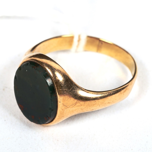 1175 - A gent's unmarked gold and bloodstone set signet ring (repaired), 5.3g, size R