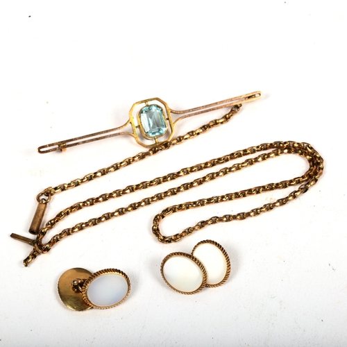 1177 - A 9ct gold and blue topaz set bar brooch, missing clip, 3.9g, a pair of unmarked yellow metal cuffli... 